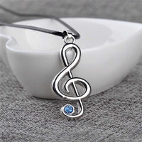EPJ Treble Clef with Blue Rhinestone on Black Round Rope Necklace